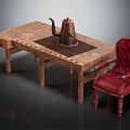Vintage Wooden Table And Red Leather Chair With Button Detail And Teapot Decor