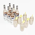 Elegant Collection of Glass Bottles and Cocktail Glasses with Lemon Slices and Yellow Straws