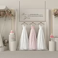 Elegant Bridal Window Display With White Pink Wedding Dresses Floral Decorations And Cake Displays