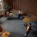 Warm Café Interior With Wooden Slat Walls Green Plants And Comfortable Seating