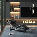 Modern Black Leather Lounge Chair In Living Room With Fireplace Floor Lamp And Bookshelves