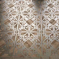 Symmetrical Wooden Parquet Floor With Intricate White Geometric Curl Patterns