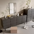 Modern Gray Dresser with Drawers and Decorative Plants Near Floor Lamp and Wall Art