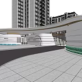 Modern Entrance Gate With Curved Awning Fronting High Rise Buildings On Tiled Plaza