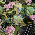 Kids Play Area Featuring Cherry Blossom Trees Green Lawns Colorful Curved Pathways Circular Play Designs