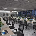 Public Office Space With Multiple Desks Computers Ergonomic Chairs Large Windows And Green Plants 3d model