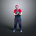 Man in Red Cap and Overalls Holding Power Tool Standing Against Gray Background