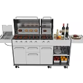 Stainless Steel Outdoor Grill Station With Wheels Storage Cabinets And Food Bottles On Countertop