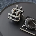 Contemporary Decorative Ornament Set Featuring Silver Metal Sculptural Piece and Black Marble Decorative Stone on Black Circular Tray