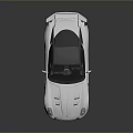 White Sports Car With Black Roof Rear Spoiler And Sleek Sporty Exterior Design