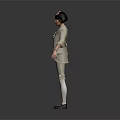 Woman Wearing Light Beige Suit With Bow Tie Standing In Neutral Gray Background