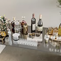 Elegant Assorted Wine Bottles And Various Glasses On Stylish Tabletop With Decor