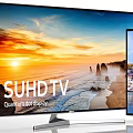 SUHD and Curved UHD Televisions Displaying Sunset Coastal Scenery and Colorful City Buildings