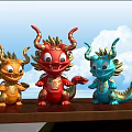 Three Carved Dragon Sculptures In Red Orange Blue With Golden Decorations On Wooden Table
