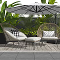 Rattan Outdoor Sofa Set With Cushions Umbrella And Green Plants On Wooden Deck