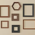 Multiple Wooden Photo Frames With Various Shapes And Brown Black Colors On Wall