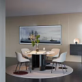 Modern Dining Table Set with Round Table White Chairs Sailing Ship Painting and Green Plants