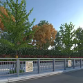 Decorative Metal Fence With Stone Pillars Along Roadside Trees And Green Belt
