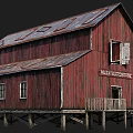 Red Barn Building With Rusted Metal Roof Wooden Structure And Maltese Cross Sign