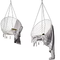 Stylish Woven Hanging Chair With Tassels And Light Blanket Decoration