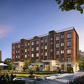 Modern Multi Story Residential Building With Red Brick Facade And Surrounding Greenery