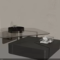 Modern Coffee Table Featuring Glass Top Metal Frame And Decorative Tray With Small Box