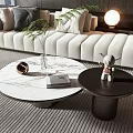 Modern Round Coffee Tables With Marble Tops Black Bases White Sofa Green Plant And Lamp