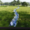 Scenic Microtopography Featuring Green Grass Trees Small Stream Stones And Distant Hills
