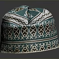 Teal Ethnic Style Hat with Geometric Patterns and Brown Leaf Designs
