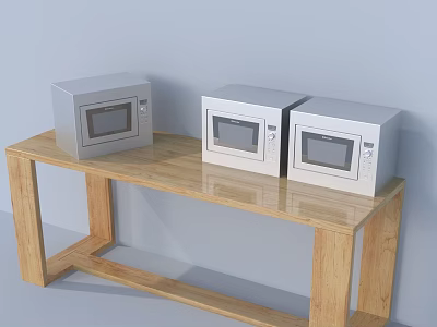 Three Stainless Steel Microwaves on Wooden Table in Kitchen with Grey Wall 3d model