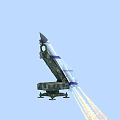 Military Weapon Missile With Blue White Stripes Launched From Camouflage Launcher Emitting Flames