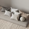 Cozy Neutral Tones Decorative Pillows On Gray Cushion With Round Textured Ball