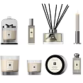 Elegant Decorative Ornament Set Featuring Reed Diffusers Candles And Fragrance Bottles On Textured Tray