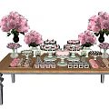 Colorful Dessert Table Arrangement With Pink Flowers And Assorted Sweet Treats