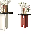 Metallic Vase With White Pink Flowers On Black Round Side Tables Red White Legs