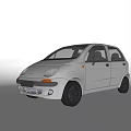 White Compact Hatchback Car With Sleek Exterior And Black Alloy Wheels Design
