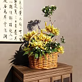 Wicker Basket Vase with Yellow Chrysanthemums and Green Leaves on Wooden Table with Calligraphy Scroll Background