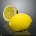 Fresh Yellow Lemons With Whole And Sliced Fruit On Dark Reflective Surface
