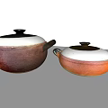 Maroon And Orange Ceramic Cooking Pots With Lids And Black Handles