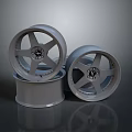 Three Silver Alloy Car Wheels Stacked As High Quality Automotive Parts