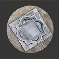 Stone Fountain With Arch Openings And Circular Base On Decorative Stone Platform