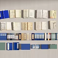 Various Colored Books and Magazines Collection with Blue Green Beige Covers Open Stacked Neatly Arranged
