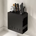 Black Kitchen Knife Block With Knives Chopsticks And Cutting Board On Light Countertop