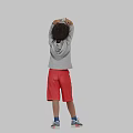 Man in Gray Hoodie and Red Shorts with Hands Raised Over Head Against Gray Background
