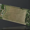 Aerial View of Farmland Area With Green Trees Road and Buildings