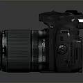 Fujifilm Black Camera Body With Pink Filter Lens On Reflective Surface