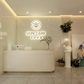Beauty Salon Interior Featuring Reception Desk Skin Care Sign Marble Wall Green Plants And Sculpture