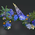 Colorful Floral Decorative Arrangement With Blue Yellow Purple Flowers And Green Plants