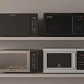 Various Types Of Modern Kitchen Appliances Microwaves On Shelf