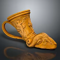 Carved Ceramic Cup With Ram Head Design And Intricate Decorative Motifs